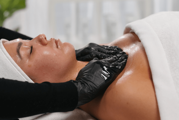 Client receiving a hydrating massage during an Express Facial to refresh tired skin, boost circulation, support hydration, and maintain a smooth, healthy-looking complexion.